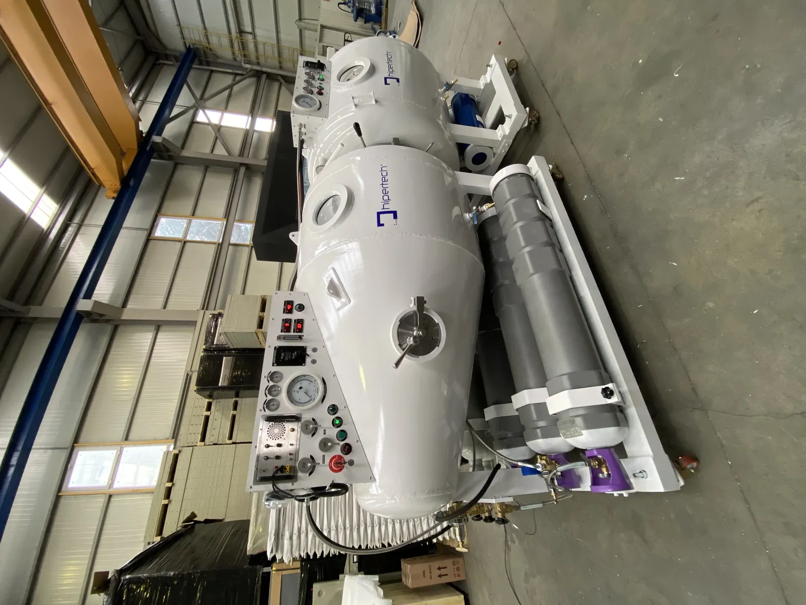 A transportable recompression chamber system from above: main lock and ante-lock in line on a single skid, composite cylinders alongside